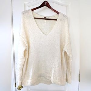Cream colored V-neck sweater by Free People, size XS